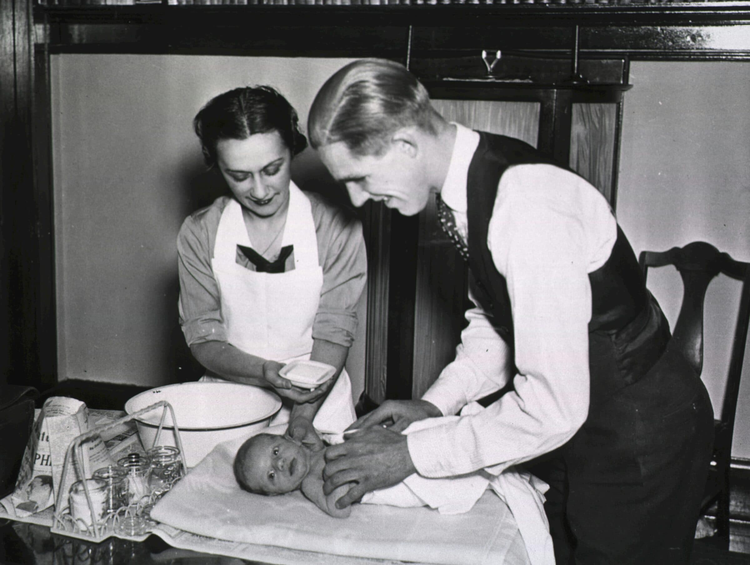 Midwife examining a newborn baby