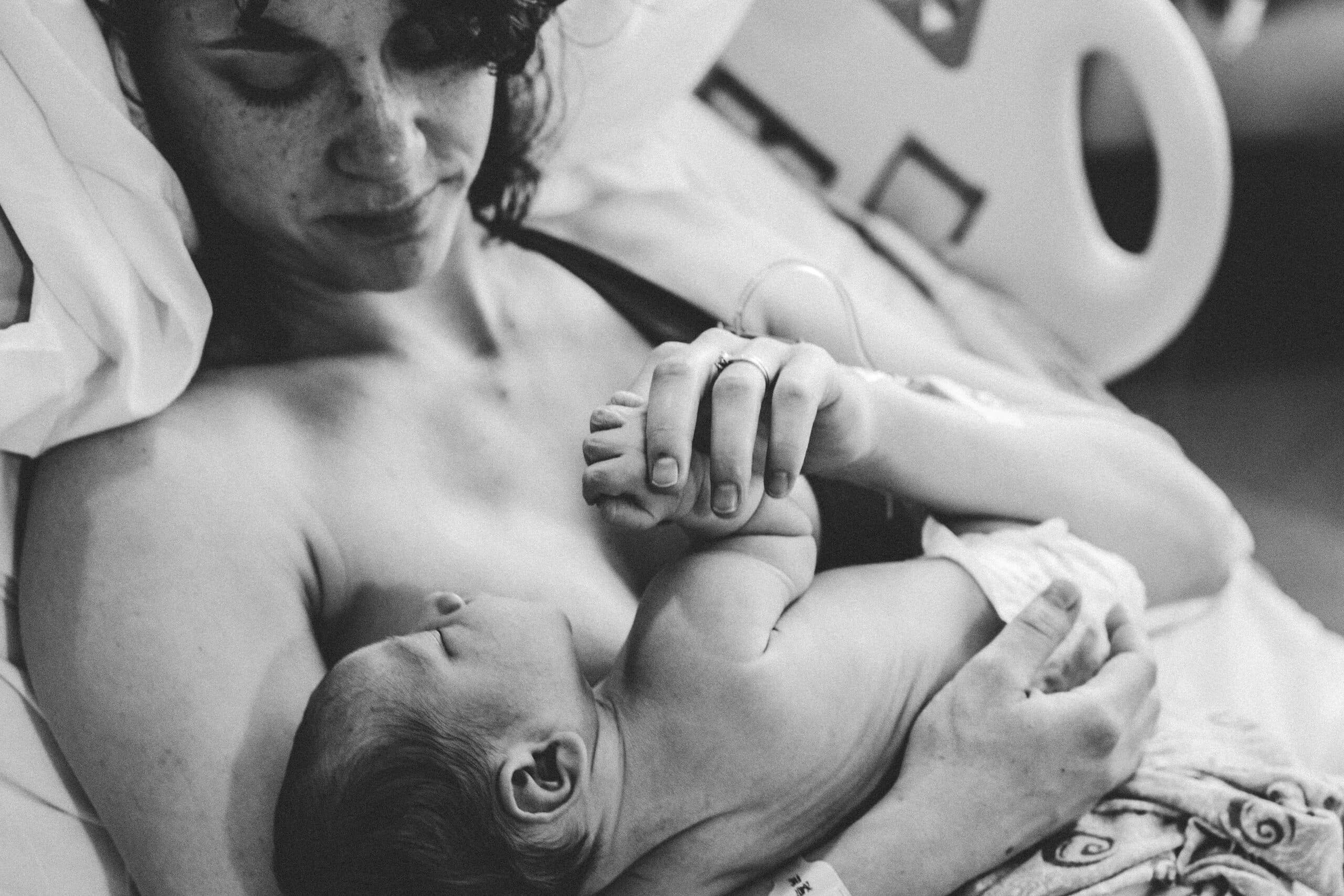 A mother with her newborn in the first hours