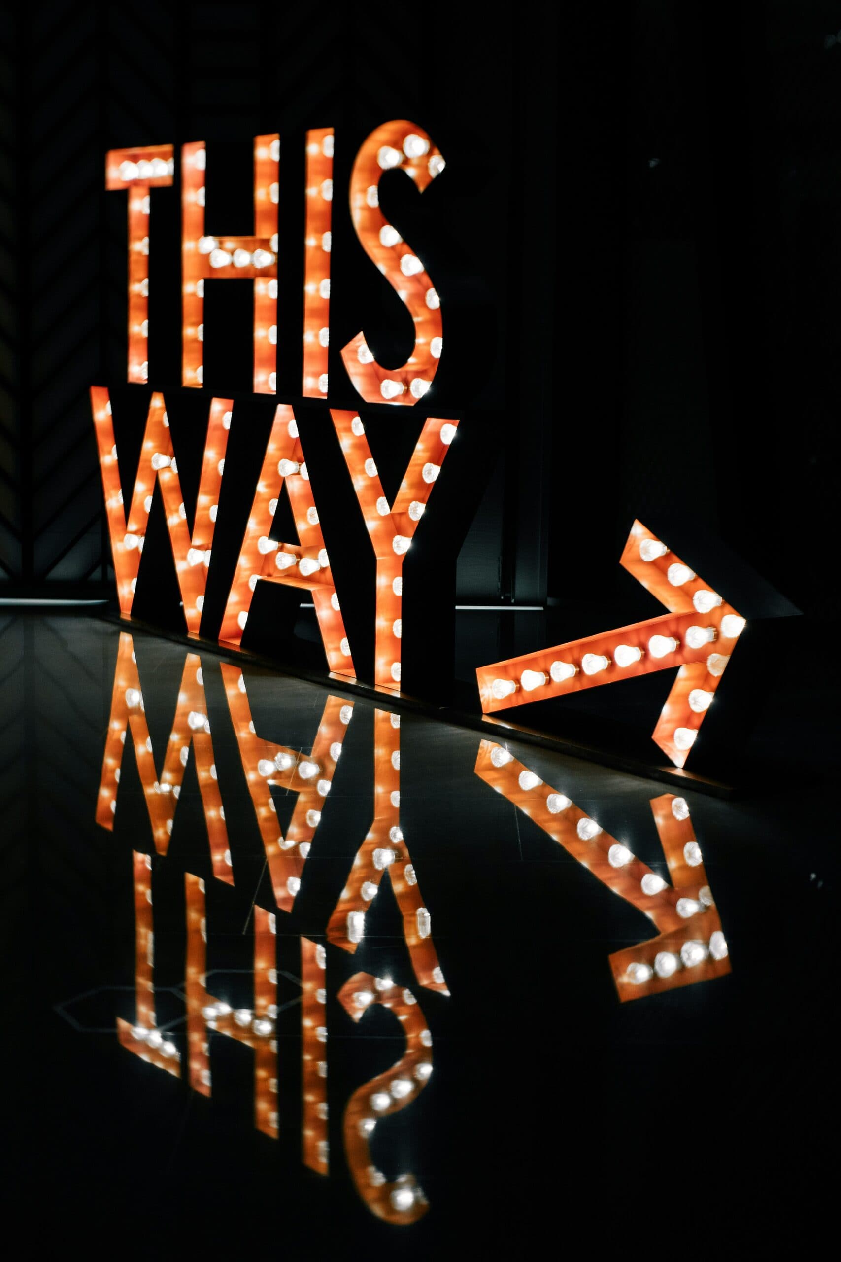 A hand-painted sign pointing the way